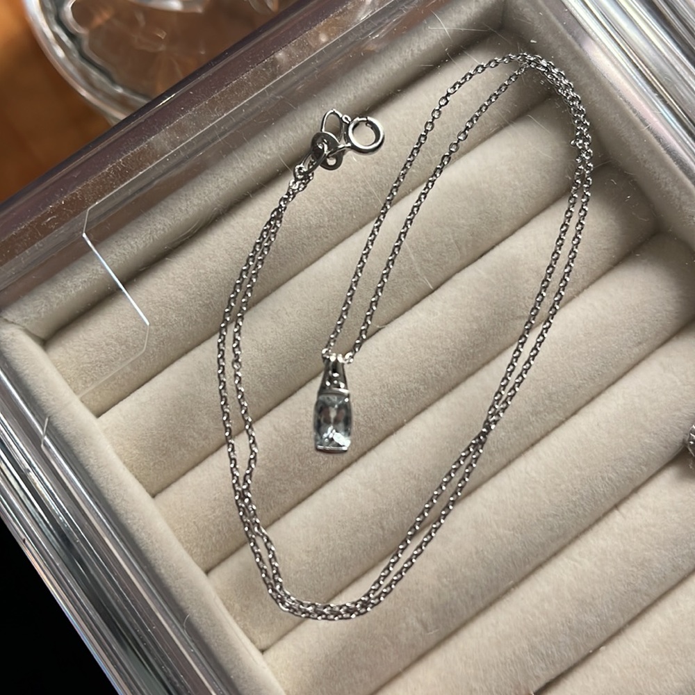 10k gold pendant with very pale blue stone